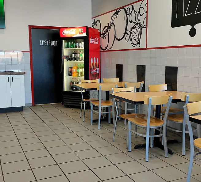 Bright dining room at Nitza's Pizza in Leduc
